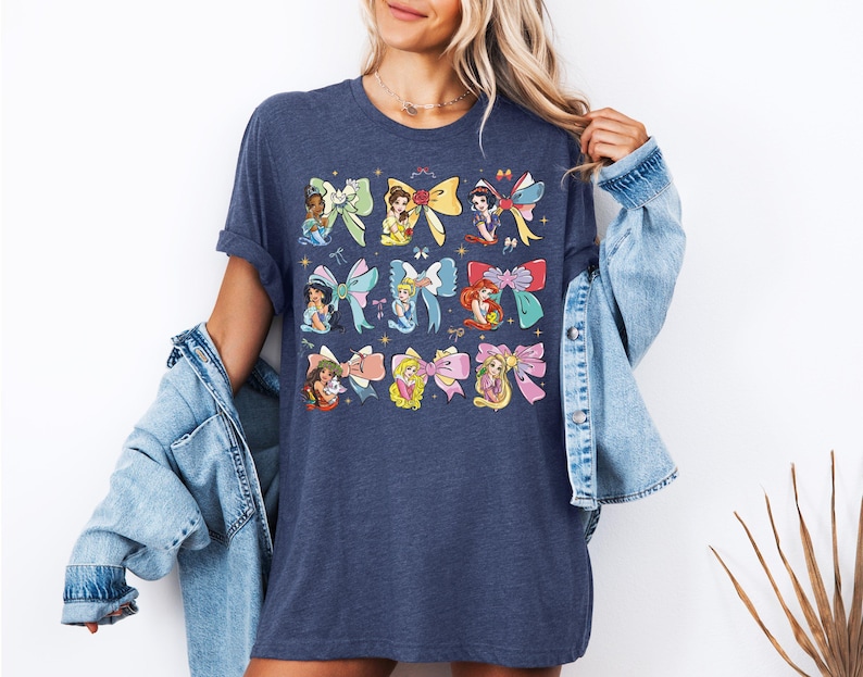 a woman wearing a disney shirt and denim jacket