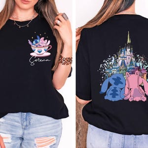 a woman wearing a black shirt with a castle on it