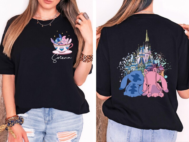 a woman wearing a black shirt with a castle on it