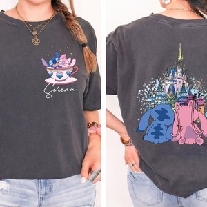 a woman wearing a disney shirt with a castle on it