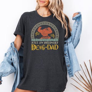 a woman wearing a t - shirt that says, just an ordinary dem - dad