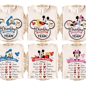 May include: Six cream-coloured t-shirts with a Mickey Mouse, Minnie Mouse, or Donald Duck design. Each shirt features a cartoon character with a beer mug and the text "Drinking Around the World - Disney Team". The shirts also include a list of countries and flags.