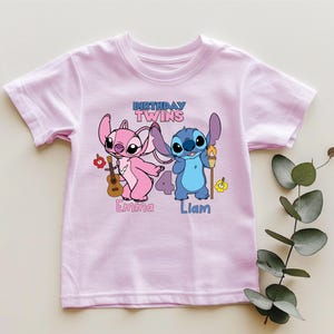 a pink shirt with a cartoon character on it