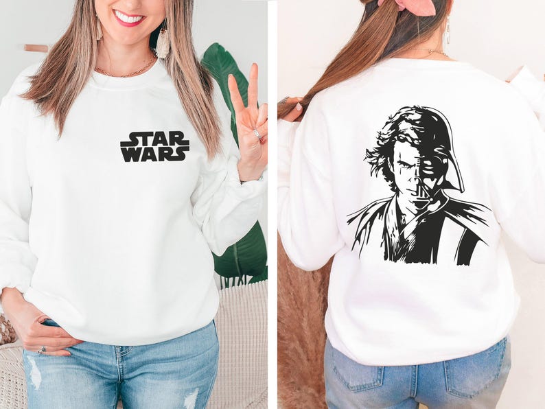 a woman wearing a sweatshirt with a star wars image on it