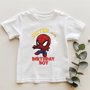 a white shirt with a spiderman on it