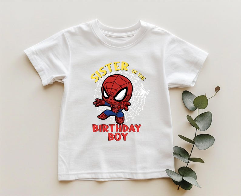 a white shirt with a spiderman on it