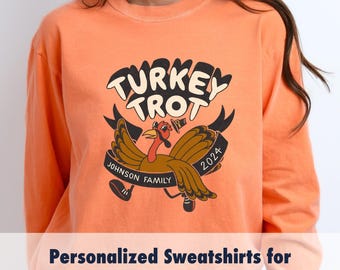 May include: Orange sweatshirt with a cartoon turkey design. The text "TURKEY TROT" is above the turkey and "JOHNSON FAMILY 2024" is below the turkey.