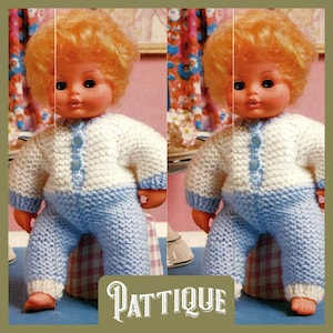 May include: Two dolls wearing knitted white and blue outfits. The dolls have blonde hair and are wearing knitted hats. The dolls are sitting on a checkered surface.