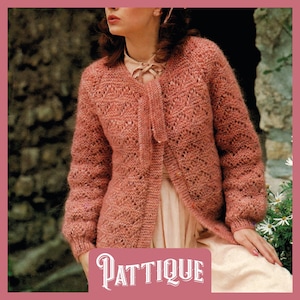 May include: A dusty rose-colored knitted cardigan with a delicate openwork pattern. The long-sleeved sweater has a tie closure and is labeled "Pattique" in a decorative font. The cardigan is worn over a light-colored dress.