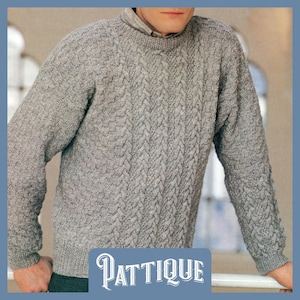 May include: A gray cable knit sweater with a crew neck. The sweater has a textured pattern and is made of a soft, warm material.