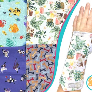 May include: Various fabrics with pet-themed designs, including cats, dogs, and bones. A wrist support with a floral and cat print is also shown. The fabrics feature light blue, purple, and grey backgrounds.