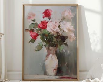 May include: A framed floral painting featuring a bouquet of roses in a vase. The roses are in shades of red and pink, with green leaves. The vase is white, and the background is a muted gray. The painting is in a gold frame.