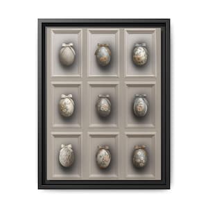 May include: A white ceramic mug with a black handle and the text "But First, Coffee" in a bold, black font. The mug is filled with a dark liquid, likely coffee, and sits on a light-colored surface.