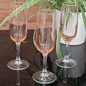 3 Luminarc pink champagne flutes with transparent stem
