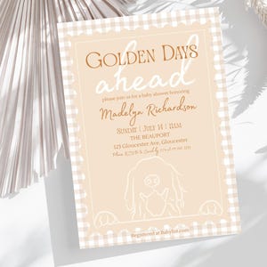 Op de afbeelding: Een uitnodiging voor een babyshower met een beige en witte gingham rand. De tekst "GOLDEN DAYS ahead" staat in een stijlvol lettertype. De uitnodiging bevat details voor de babyshower van Madelyn Richardson, met een hondenillustratie onderaan.