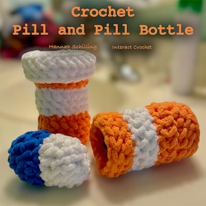 May include: Crocheted pill bottle and pill, in orange, white, and blue. The pill bottle is open and the pill is sitting next to it. The text "Crochet Pill and Pill Bottle" is at the top of the image. The text "Hannah Schilling" and "Interact Crochet" are below the title.