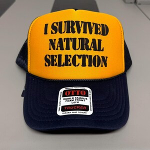 I SURVIVED NATURAL SELECTION Puff Print Trucker Hat