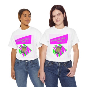 May include: Two white t-shirts featuring a graphic design of a margarita glass and the text "Tequila'n Me, Girl!" in pink and green. The shirts are being modelled by two people.
