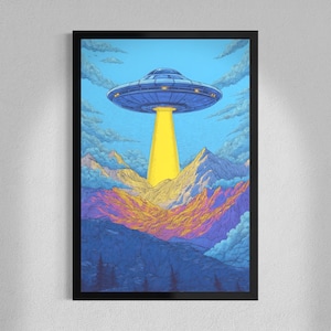 May include: A framed art print depicts a blue UFO hovering above a mountain range. The UFO emits a yellow beam of light. The mountains are a mix of purple, orange, and blue hues, set against a blue sky with clouds.