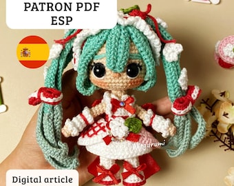May include: A crocheted doll with turquoise hair, wearing a white and red dress. The doll has large black eyes and is holding its arms out. Text on the image reads "PDF PATTERN PATRON PDF ESP" and "Digital article Articulo digital".