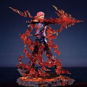 Detailed anime figure statue depicting a powerful cursed king and heroic fighter locked in battle, collectible display model for fans.
