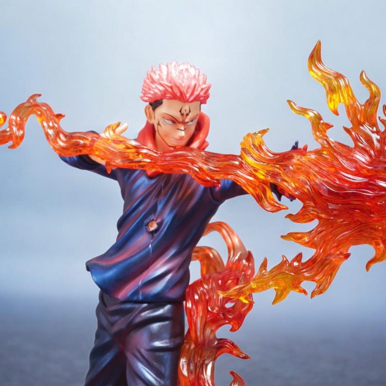 Detailed anime figure statue depicting a powerful cursed king and heroic fighter locked in battle, collectible display model for fans.