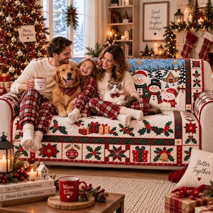 May include: A quilted sofa cover featuring a festive Christmas theme with poinsettias, holly, gift boxes, and ornaments. The design includes a snowy landscape with three snowmen labeled William, Alex, and Wendy, and a cozy cabin in the background.