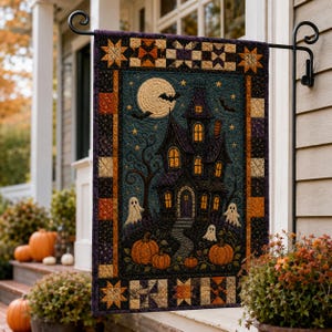 May include: A rectangular fabric garden flag featuring a quilted border of orange, black, and cream star patterns. The center depicts a dark haunted house with glowing yellow windows, a full moon, flying bats, three white ghosts, and orange pumpkins.