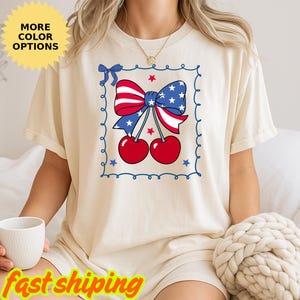 Camiseta con lazo de cerezas americanas, camiseta del 4 de julio con cerezas americanas, camiseta patriótica para mujer, camiseta femenina del 4 de julio, camiseta con la bandera de EE. UU., camiseta de regalo
