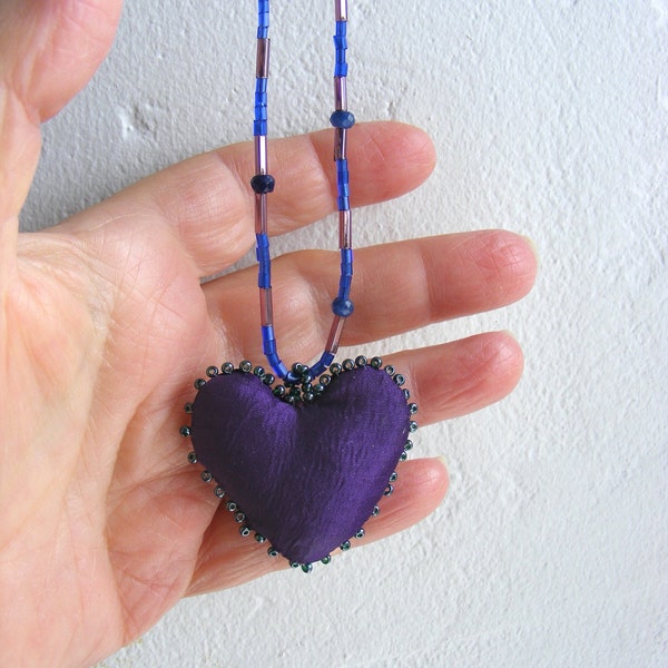 Small fiber art necklace, textile pendant statement piece, handmade heart pillow, beaded and unique