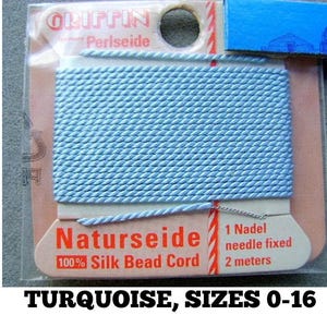 May include: A spool of light blue 100% silk bead cord, labeled "Naturseide 100% Silk Bead Cord" with a needle attached. The label also states "1 Nadel needle fixed 2 meters".