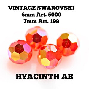 May include: Four faceted Hyacinth AB Swarovski crystals. The crystals are 6mm and 7mm in size. The image includes the text "VINTAGE SWAROVSKI" and "HYACINTH AB".