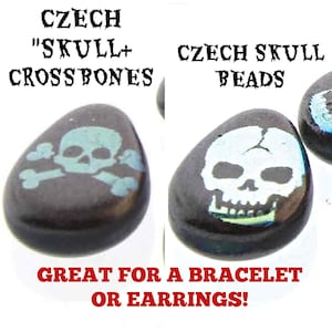 May include: Two black Czech glass beads with skull designs. One bead has a white skull with crossbones and the other has a blue skull. The text "CZECH SKULL CROSSBONES" and "CZECH SKULL BEADS" is printed above the beads. The text "GREAT FOR A BRACELET OR EARRINGS!" is printed below the beads.