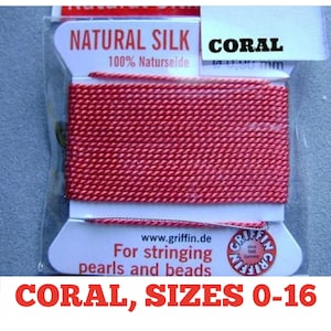 May include: Coral colored natural silk string for stringing pearls and beads. The packaging says "Natural Silk 100% Naturseide" and "Coral". The packaging also says "For stringing pearls and beads" and "www.griffin.de".