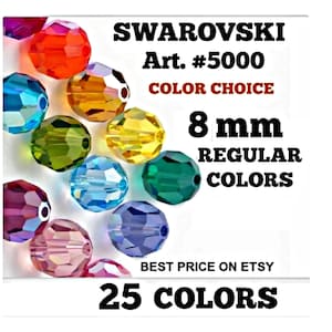 May include: A collection of faceted 8 mm Swarovski Art. #5000 crystal beads in various colours including red, orange, yellow, green, blue, purple, and pink. The text reads SWAROVSKI Art. #5000 COLOR CHOICE 8 mm REGULAR COLOURS 25 COLOURS.