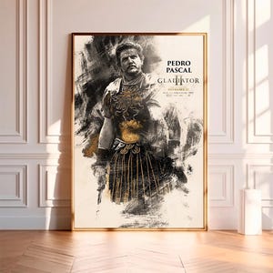 May include: A black and white poster featuring a stylised image of a man in a gladiator costume. The poster has the text "PEDRO PASCAL GLADIATOR II IN THEATERS NOVEMBER 22".