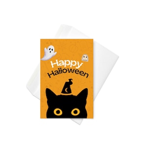 May include: A rectangular greeting card with an orange background featuring a black cat silhouette wearing a witch hat, two white ghost illustrations, and the text Happy Halloween in black and white, accompanied by a plain white envelope.