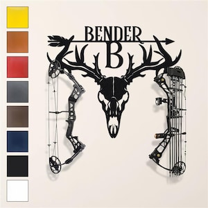 May include: A black metal wall art piece featuring a deer skull with antlers, the name "BENDER" above, and a large letter "B" below. Two bows are mounted on either side. Color swatches are shown on the left.
