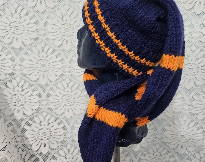 110-Long stocking hat Navy blue with orange matching pompom length is 42"