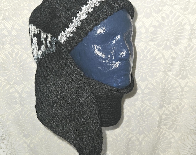 142-Long stocking hat main color is black with Newsprint fur pom pom 47"