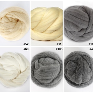 May include: Ten balls of yarn in various colors, including white, cream, light gray, dark gray, and black. The yarn is arranged in two rows of five balls.
