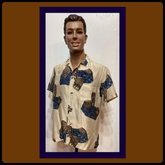 HS145 1950's vintage silk tiki print Hawaiian shirt by Polynesian Casuals for McInerny Honolulu. Size large