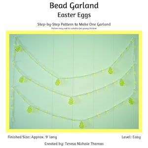 May include: A beaded garland with green Easter egg-shaped beads hanging from it. The garland is 9 feet long and is made with white and light green beads. The garland is hanging on a light green wall.