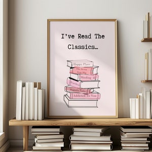 Pode incluir: Uma impressão de arte de parede imprimível rosa e branca com o texto "I've Read The Classics..." e uma pilha de livros com títulos como "Happy Place", "The Seven Year Slip", "Heartless", "Binding 13", "Magnolia Parks" e "Addicted To You".