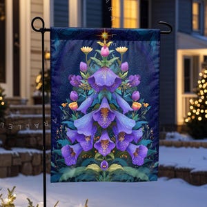 May include: A garden flag with a floral design, showcasing purple bell-shaped flowers and yellow accents against a dark blue backdrop. The flag is displayed outdoors in a snowy setting, adding a seasonal touch to the garden.