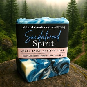 May include: A blue and white swirl artisan soap bar with a black label that reads "Natural Fresh Rich Relaxing Sandalwood Spirit Small Batch Artisan Soap Luxury Cold Process Soap Bar Net wt. 5oz/141g"