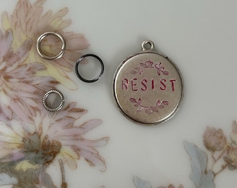 Resist charm / silver with pink floral