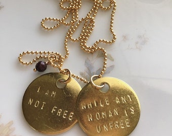 Audre Lorde Quote Necklace: Hand Stamped Brass, Garnet Bead, I am not free while any woman is unfree