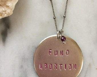 FUND ABORTION necklace with ruby