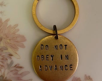 Do Not Obey in Advance keychain / handstamped gold plated pewter